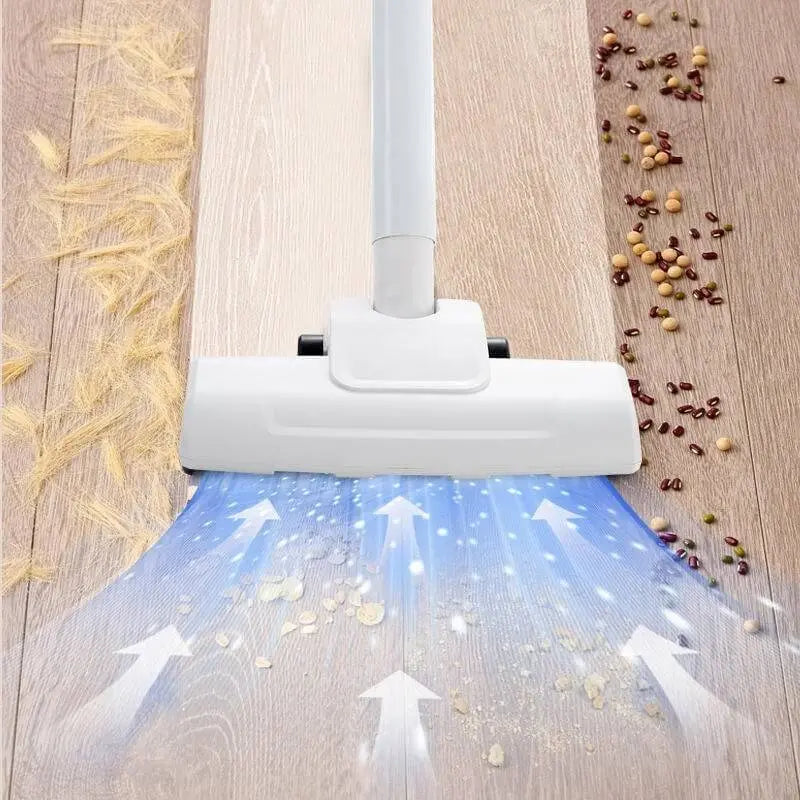 A person uses the white and orange 3-in-1 handheld vacuum to clean a sofa..Handheld vacuum cleaner being used on a beige sofa3-in-1 Wireless Vacuum Cleaner