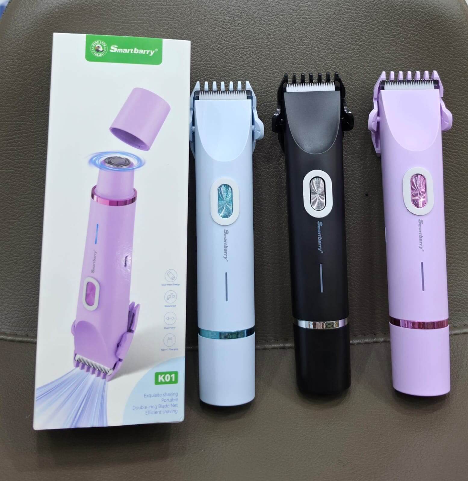 Set of hair trimmers with packaging on a gray surface. 2 in 1 Dual Head Shaver Women