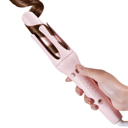 Pink hair curler being used on a white background. automatic curling iron for salon-quality curls