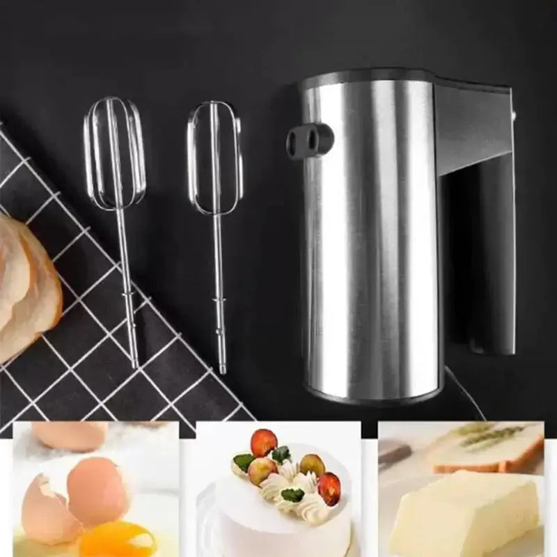 Hand mixer with attachments on a blurred background of cupcakes