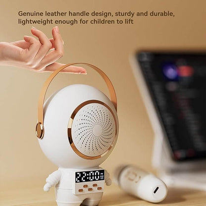 White robot toy with gold accents held by a hand, on a beige background. Astro Speaker