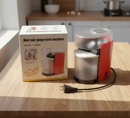 Hot air popcorn maker on a wooden table with its packaging