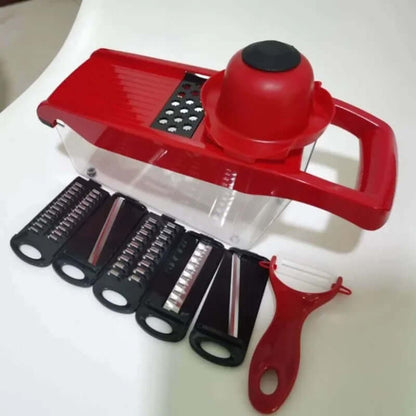 Red mandoline slicer with interchangeable blades on a white background. Mandoline Vegetable Slicer and cutter