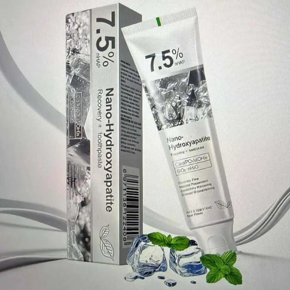 Tube and box of Nano-Hydroxyapatite product on a light gray background. nano hydroxyapatite fluoride toothpaste