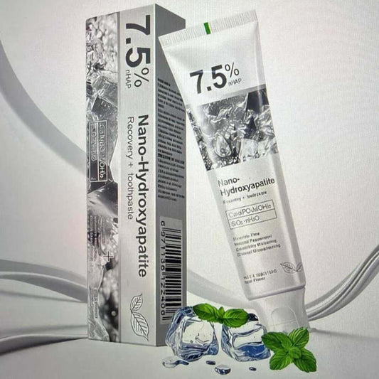 Tube and box of Nano-Hydroxyapatite product on a light gray background. nano hydroxyapatite fluoride toothpaste