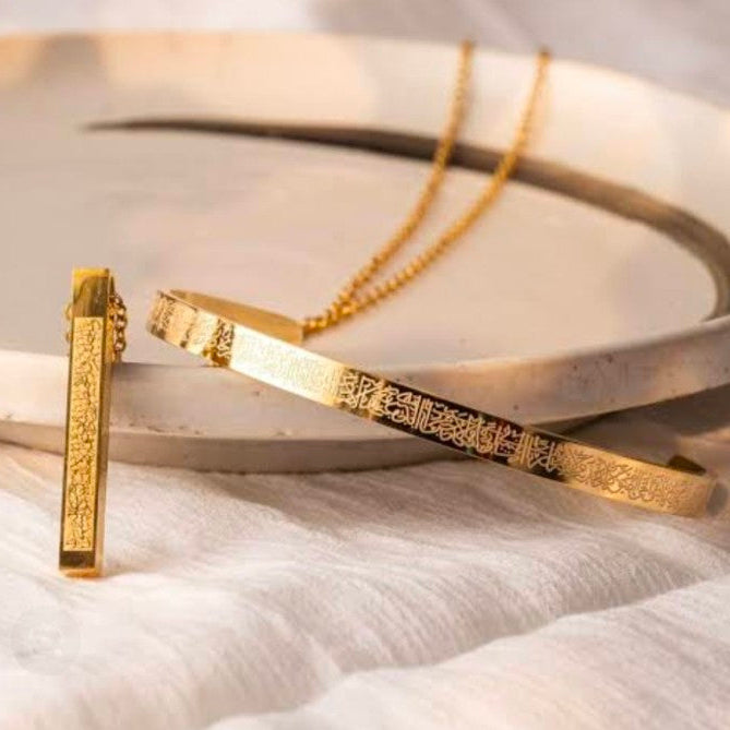 Gold Ayat ul Kursi bracelet and necklace set with Arabic calligraphy displayed with a buy one get one free offer.