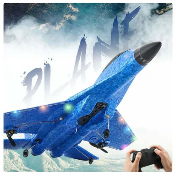 Blue toy airplane with remote control held by a hand against a mountainous background.RC fighter jet remote control airplane
