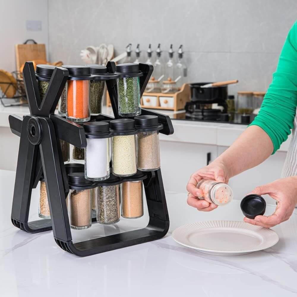 Black spice rack with various spices on a kitchen counter.spice rack organizer with jars