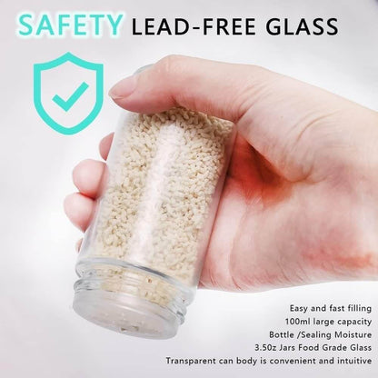 Hand holding a glass container with a transparent lid, filled with small white granules, on a light gray background.. spice rack organizer with jars