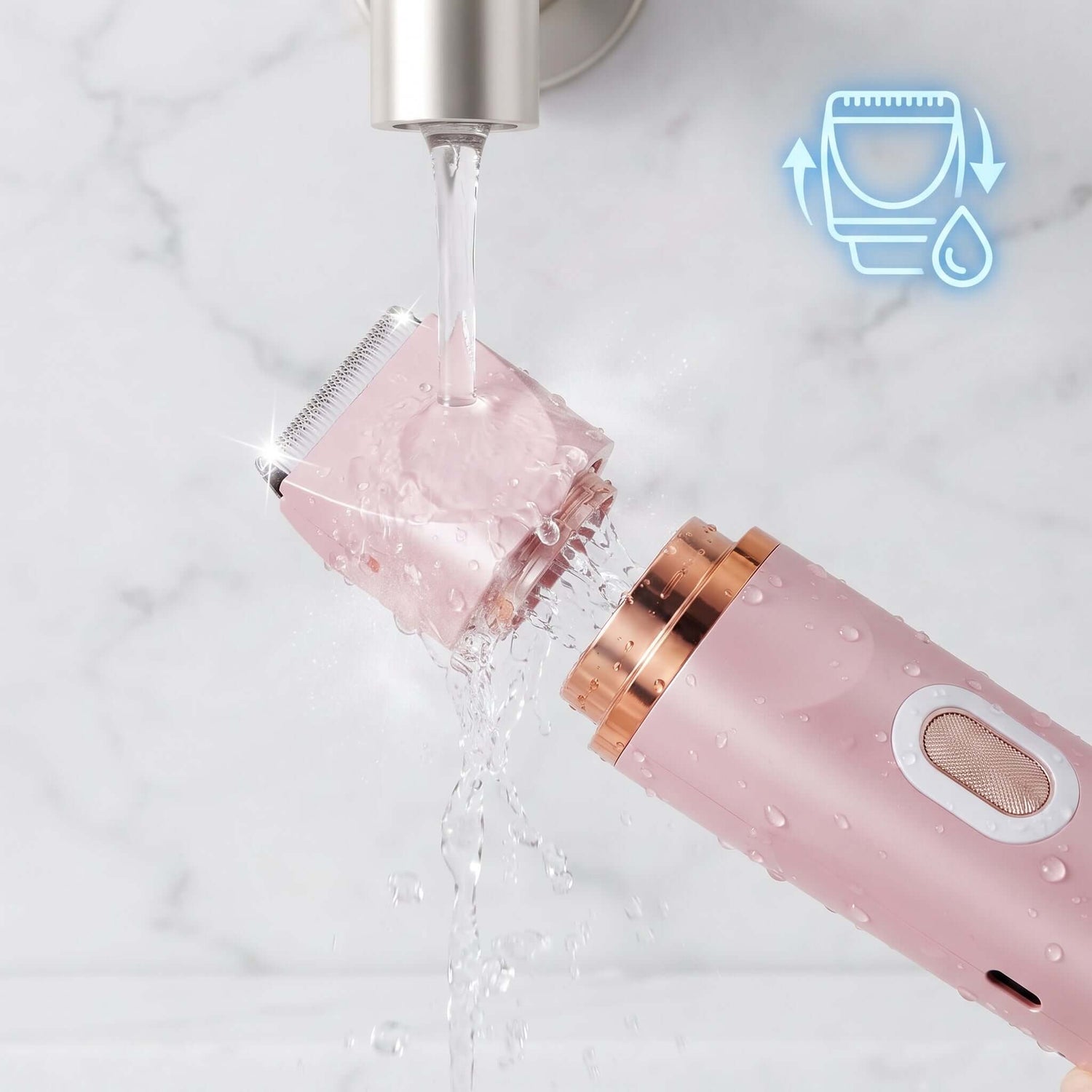A pink electric facial hair remover with rose gold accents is shown under running water from a faucet on a white marble background, with a blue water-cleaning icon in the top right corner.